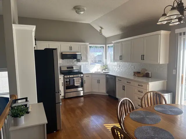 Olathe, KS kitchen refresh with white Shaker cabinet doors, quartz counters and stainless appliances